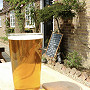 A pint of beer on a table outside the Frog and Nightgown