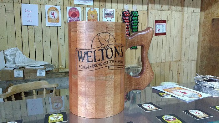 Wooden beer jug on the bar